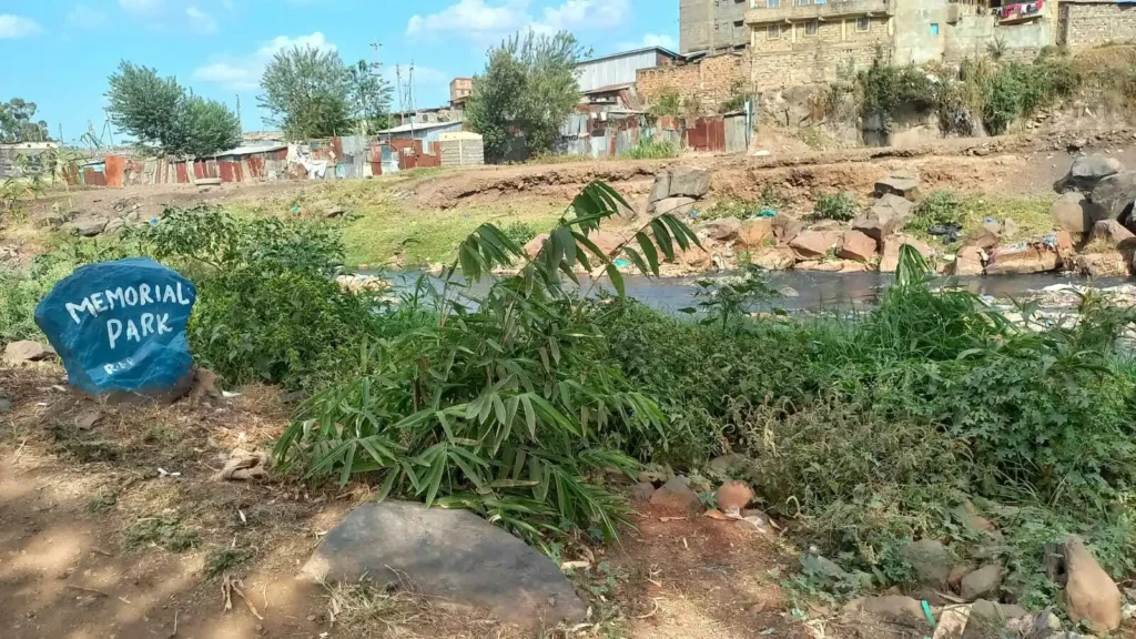 The Komb Green Memorial Park with Nairobi River flowing on in the background.